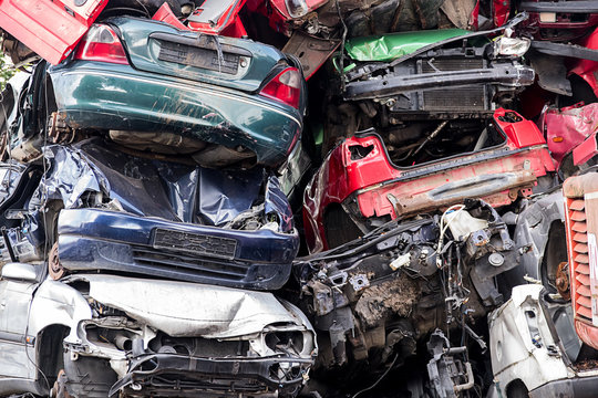 pile of discarded scrap car on a junkyard, concept for insurance or  waste management