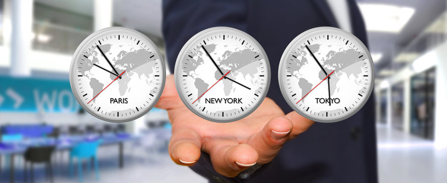 Businessman holding time of the world in his hand