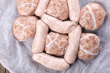 Fresh raw chicken sausages and burgers.