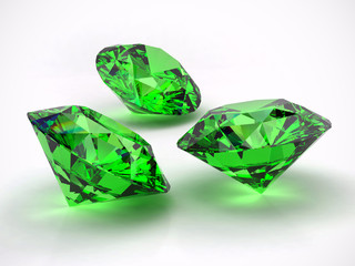 Fototapeta premium Green Diamonds isolated on white background with light reflection. 3d