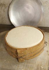 fresh cheese with ancient wooden mold