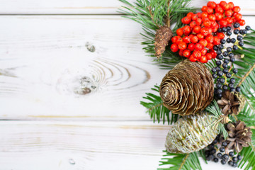 Christmas fir tree with cones and forest berries copy space
