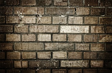 A gritty brick background in sepia tone