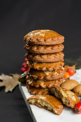 Typical Dutch filled spicy  cookies with almonds on autumn color