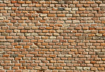 massive red brick wall of the medieval castle