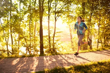 Wall murals Jogging Fit woman running in the morning