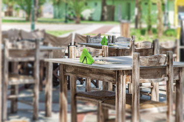 Empty restaurant tables in the Grek city