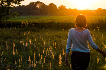 Fototapeta premium Beautiful portrait rad- hair girl in the park