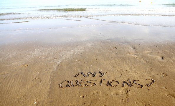 Any Questions writing on the beach sand