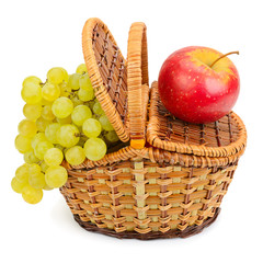 grapes and apple in the basket isolated on a white background