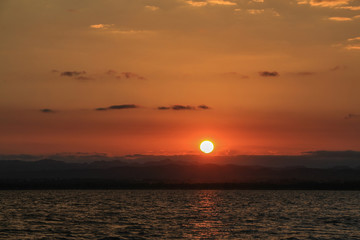 Sunrise landscape with blue sky on the lake with cloudy