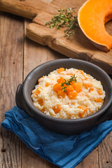 rice with pumpkin in a clay bowl