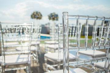 Transparent plastic chairs for wedding guests