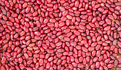 Red kidney bean texture background. Also called Rajma or Mexican Bean. A large, kidney-shaped bean with a subtle sweet flavor and soft texture that keep their shape during cooking.