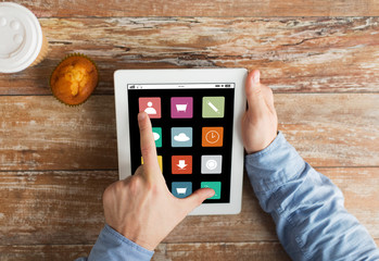 Naklejka na ściany i meble close up of hands with menu icons on tablet pc