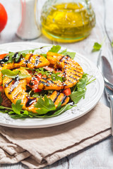 Delicious grilled pumpkin and arugula  salad 