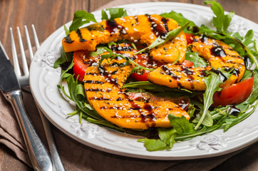 Delicious grilled pumpkin and arugula  salad 