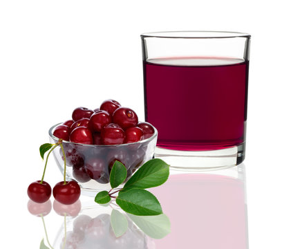 cherry juice in a glass with cherries
