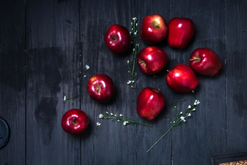 Red apple on the dark table