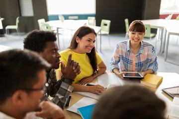 group of high school students with tablet pc