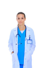 Fototapeta premium Beautiful young woman in white coat posing with hand in pocket.