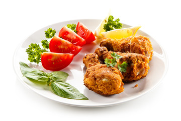 Roasted chicken drumsticks and vegetables