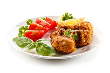 Roasted chicken drumsticks and vegetables