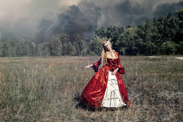 Blonde woman with long curly hair with flower accessory in antique red dress