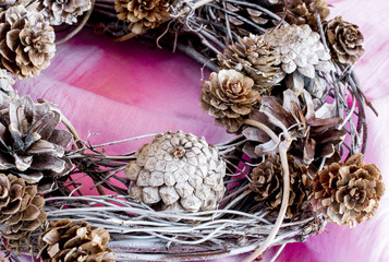 Handmade x-mas wreath on pink cloth