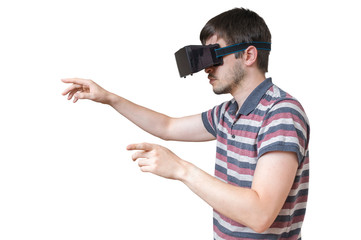 Man is wearing vr glasses and touching something. Isolated on white background.