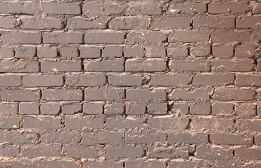 Old brick wall with paint