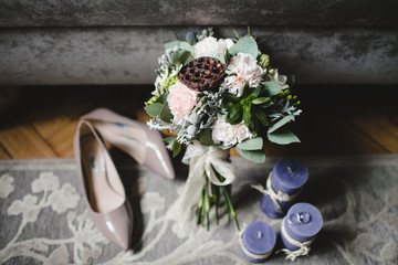 Beautiful bride shoes, wedding bouquet and rings