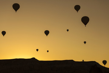 Silhouette of balloons over sunrise in Cappadocia, Turkye