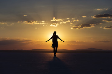 Woman blessing the sunset