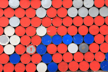 Large metal barrels stacked in a row