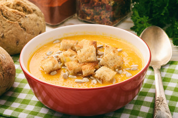 Vegetarian meal - cream carrot soup with sunflower seeds. 
