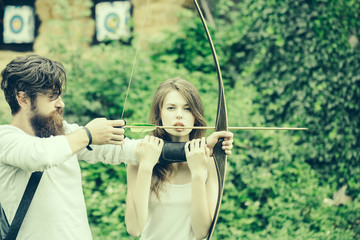 Attractive couple shoots out of the bow