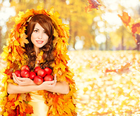 Naklejka na ściany i meble Autumn Apples, Woman Fruits in Fall Leaves Clothes, Fashion