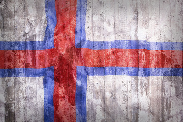 Fototapeta premium Grunge style of Faroe Islands flag on a brick wall