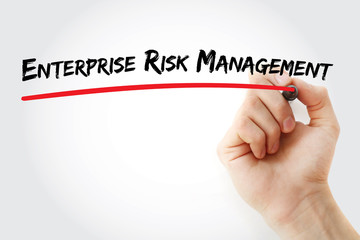 Hand writing Enterprise Risk Management with marker, concept background