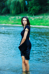 Fototapeta premium young sexy woman standing in water