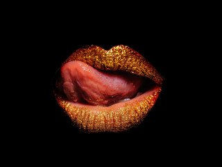 gold sexy female lips isolated on black