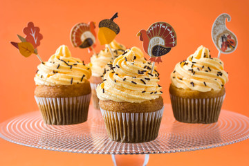 Thanksgiving cupcakes on orange background

