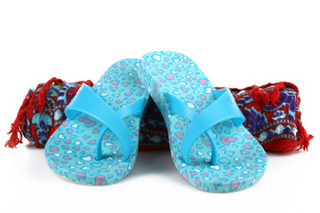 Beach flip flops and sarongs on white isolate background. 