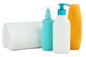 Sunscreens with a towel isolated on white background