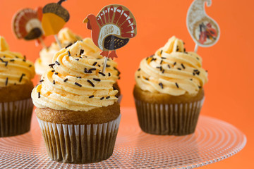 Thanksgiving cupcakes on orange background

