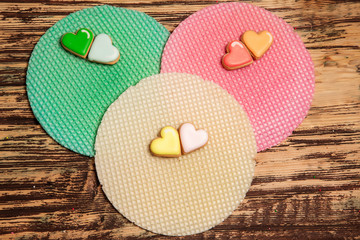 colorful cookies and waffle on wood
