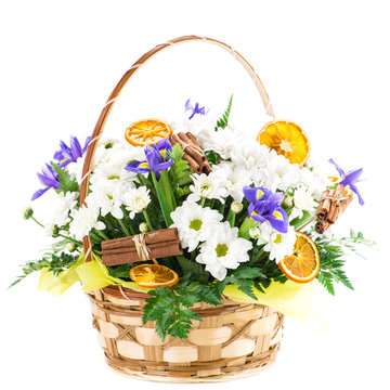 basket with fresh flower, cinnamon and orange, gift, isolated on