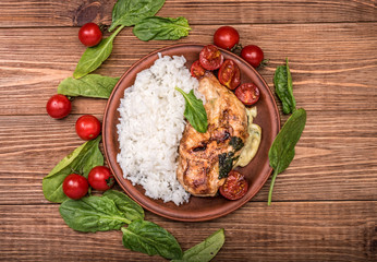 Spinach and cheese stuffed chicken breast  with rice.