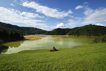 flooded church in toxic red polluted lake due to copper mining, Geamana village, Romania
